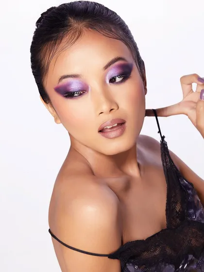 Another angle of the purple smokey eye look, paired with a delicate lace top for a soft yet dramatic feel.