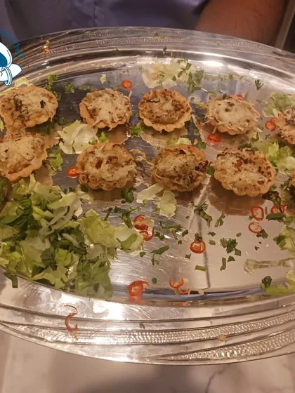 A tray of mini tarts, showcasing the variety of appetizers we can offer.