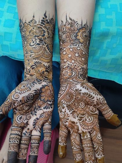 A duplicate of 121, showing the same unique crown-like henna design.