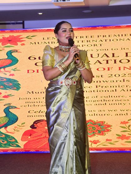 A full-stage view at the Lemon Tree Hotels event. My stage presence is about being both a focal point and a facilitator of the evening's proceedings.