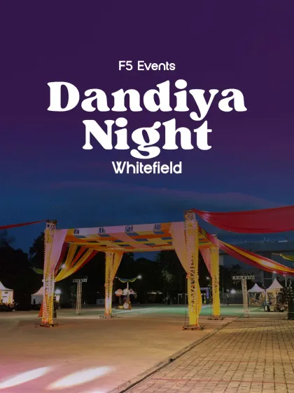 This is how a celebration begins. I designed and built this grand entrance for a Dandiya Night in Whitefield, using vibrant drapes and structured trussing to create an inviting and festive atmosphere from the very first step.