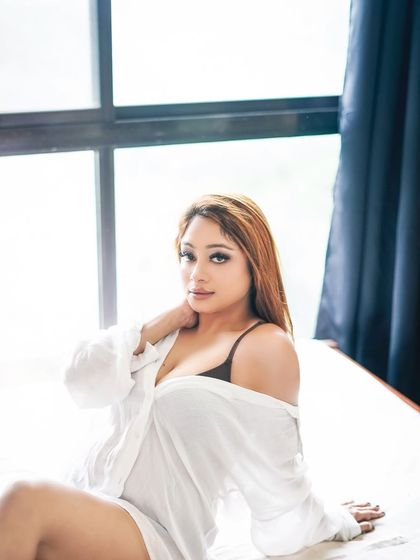 This shot captures a relaxed and comfortable moment, showcasing my ability to make clients feel at ease in front of the camera for authentic portraits.