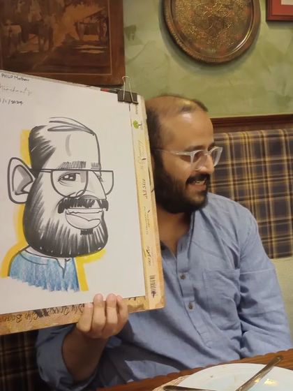 Another angle of the guest from image 275, showing his appreciation for the artwork.