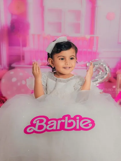It's official! This portrait with the "Barbie" logo makes it clear who the star of this fun, themed photoshoot is.