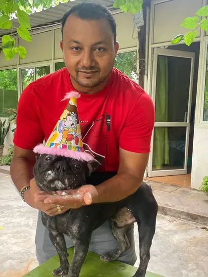 For me, these pets are like my own bachhe. I'm personally involved in their care every single day, and that includes celebrating their special moments. Here I am with Phil the French Bulldog on his birthday, making sure he feels all the love.