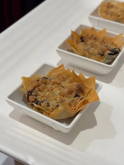 A close up of our beautiful and delicious blueberry crumble tarts, a perfect Western dessert option.