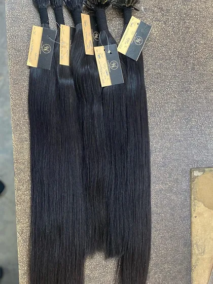 Bundles of our I-Tip extensions with tags, ready for shipping to salons and stylists.