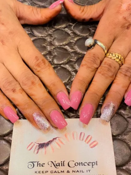 A duplicate of image 266, showing a lovely set of pink square nails with silver glitter accent nails.