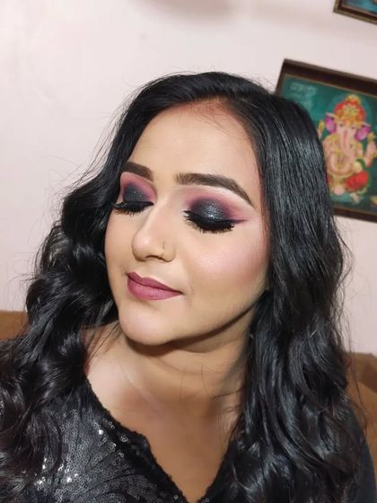 A detailed shot of the pink and black smokey eye makeup.