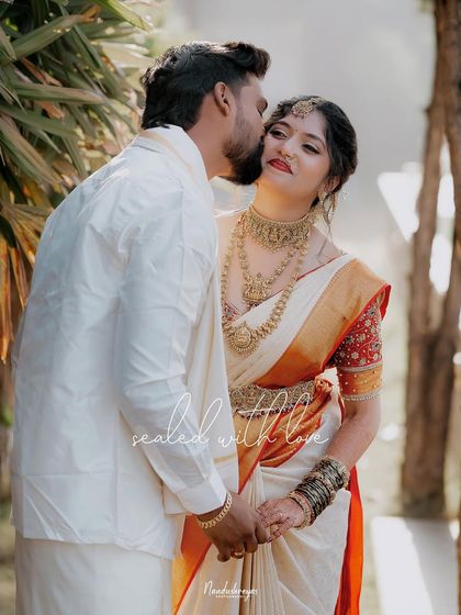 "Sealed with love." This portrait captures a sweet kiss on the cheek, a moment of affection that is both candid and beautifully composed.