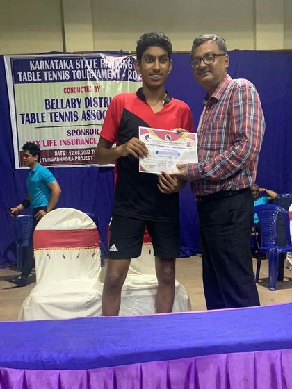 Aakash KJ receiving his certificate for winning the U19 Championship at the State Ranking Tournament in Bellary District.