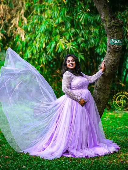 My collection includes beautiful maternity flying gowns in a variety of colors, like this delicate lavender one. The sheer, flowing trail adds a touch of magic to your maternity portraits.