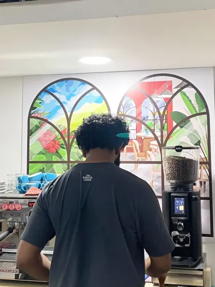 Our trainer Adwaith Menon working with an espresso machine during a workshop. We bring in experts to share their international experience and techniques with our students.