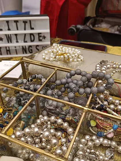 A beautiful display of handcrafted bracelets from 'Little Wilde Things', showcasing the kind of unique accessories visitors can discover.