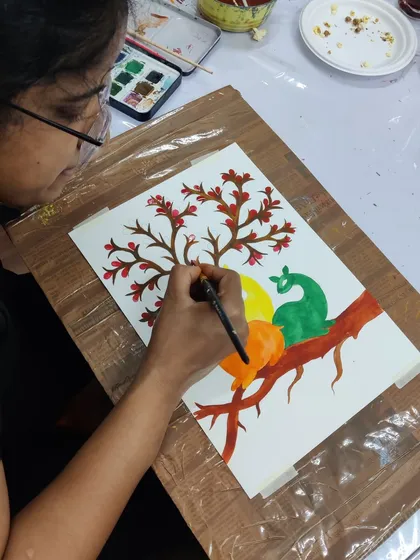 A collection of images from our Gond painting workshop, showing students engaged in the process and their beautiful finished pieces.