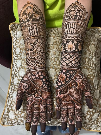 Another example of my full bridal work, where I've used a mix of bold lines and delicate patterns. The design features lotus domes and dense jaal work for a traditional feel.