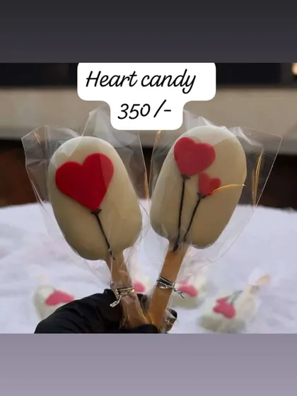 These 'Heart Candy' cakesicles are individually wrapped, making them great for gifting or as party favors. The red heart balloon design is simple, sweet, and romantic.