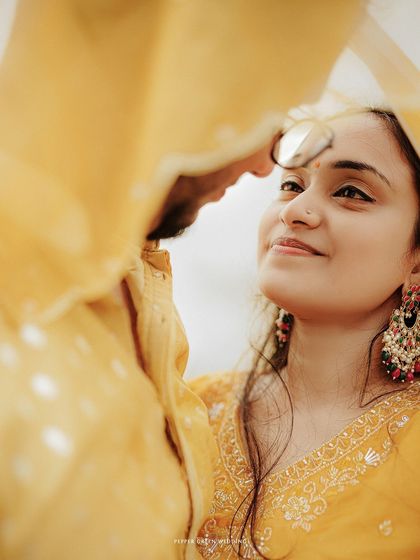 A beautiful close-up portrait from a beach pre-wedding shoot, capturing a look of love and admiration.