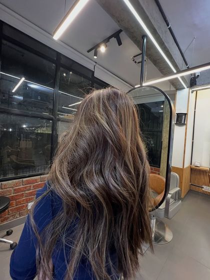 The same stunning brunette balayage, showing the reflection and shine under our salon's lighting.