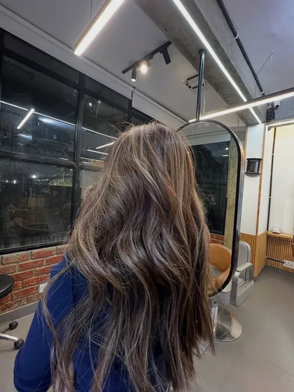 The same stunning brunette balayage, showing the reflection and shine under our salon's lighting.