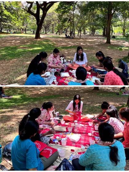 Two wide shots of me teaching the group during the Warli art picnic. The circular seating arrangement fosters a sense of community and allows for easy interaction and shared learning.