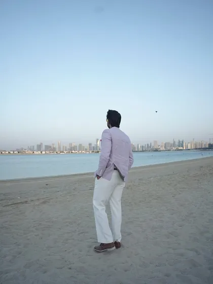 A moment of contemplation, looking out at the Dubai coastline. These quiet moments help me recharge for the high-energy events.