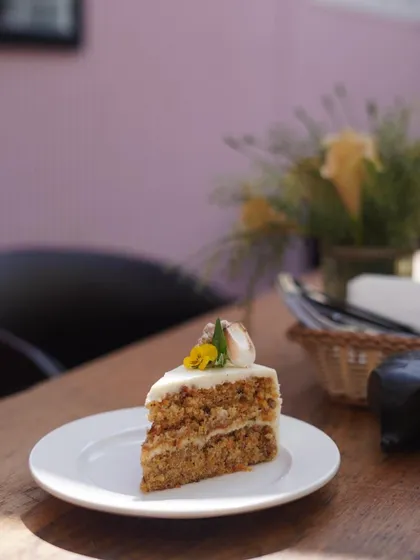 Our classic Carrot Cake is something people keep coming back for. It is moist, perfectly spiced, and layered with a light, creamy frosting. It’s the perfect sweet ending to any meal or a delightful treat with your afternoon coffee.