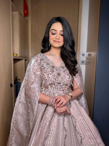 Simple and elegant soft waves for this beautiful client. This is a timeless look that exudes grace and sophistication.