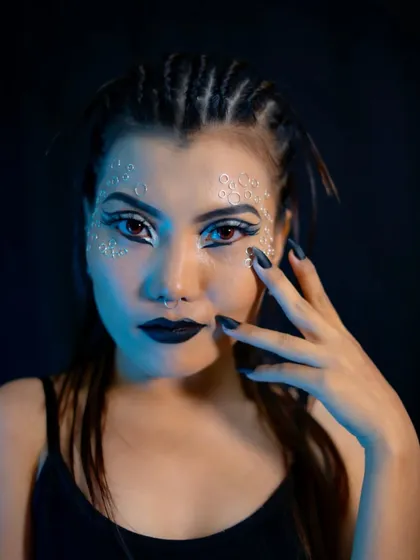 The catwalk look under blue lighting, giving it a futuristic and cool vibe.