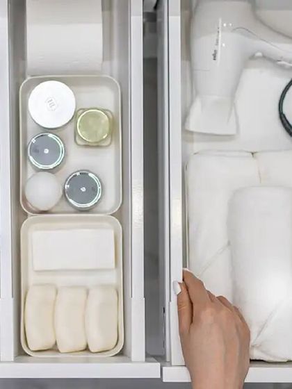 Bathrooms are prone to clutter. The key to an organized bathroom is having a system in place. This guide shows you how to use hidden storage and other tricks to declutter.