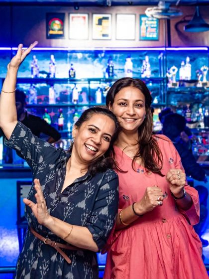 Two friends dancing and posing for the camera. It's all about having fun and making memories.