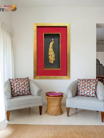 This handcrafted golden peacock, a symbol of grace and beauty, is transformed into a luxurious art piece. We used a deep object frame with a striking red raw silk mount and a gold leaf outer frame to create a truly regal display.