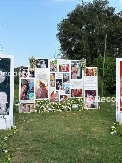The personalized photo gallery setup, showing the arrangement of large portraits and the central collage wall.