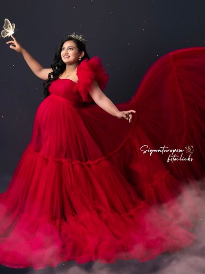 This version of the fantasy portrait showcases the dreamy, ethereal quality of the edit and the vibrant red gown.