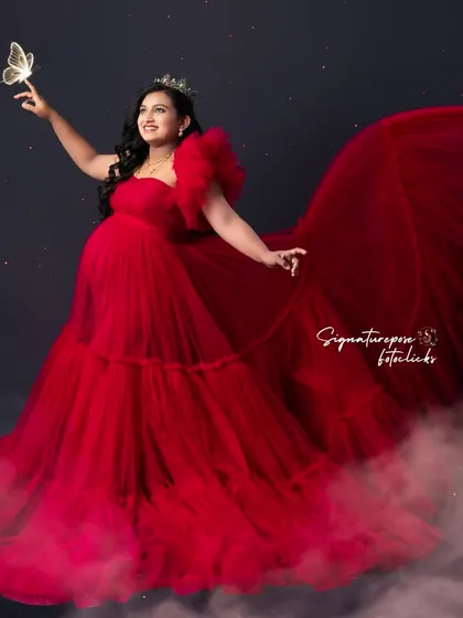 This version of the fantasy portrait showcases the dreamy, ethereal quality of the edit and the vibrant red gown.