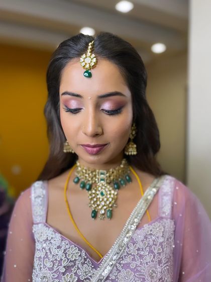 A detailed shot of Manasa's reception eye makeup. The blend of pink and purple shimmers creates a dreamy, ethereal effect.