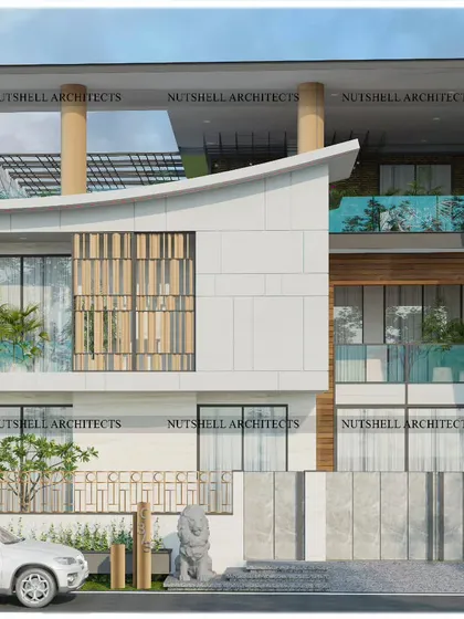 This facade creates the illusion of a grand, double-height entrance using clever single-height design. The curved roofline and turquoise-tinted glass railings add a soft, dynamic quality to the otherwise strong, geometric structure, flanked by lion statues for a regal welcome.