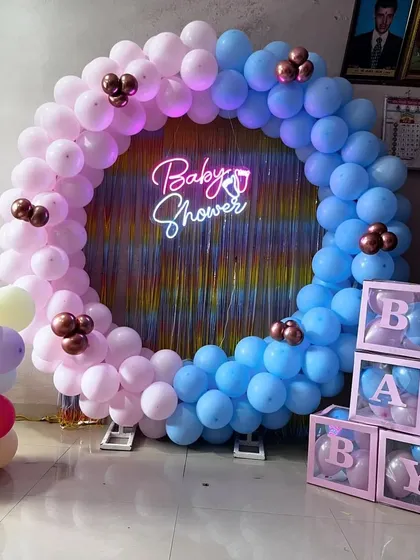 Another perspective of the popular gender-themed baby shower balloon ring setup.