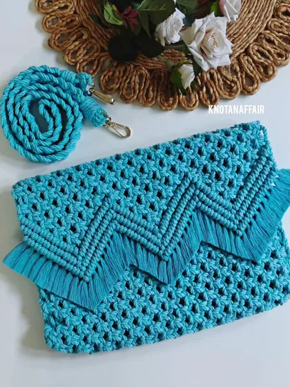 I love the fresh, beachy vibe of this turquoise macrame sling bag. The design features a chevron-patterned flap with soft fringes, and it's made from 100% eco-friendly cotton. It’s the perfect size for your essentials and comes with a matching detachable strap.