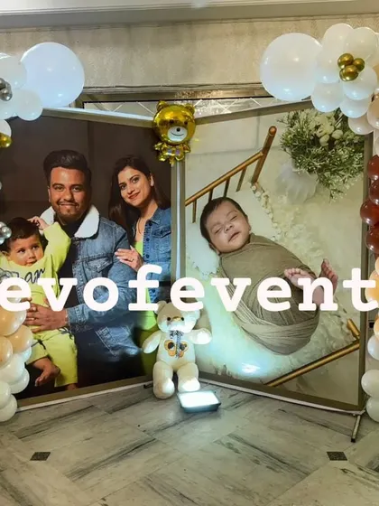 Make it personal with a custom photo backdrop. For this teddy bear themed party, I created a display with large family photos, framed by balloon columns.