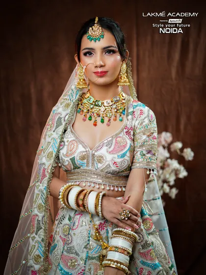 Our courses go beyond nails to include professional makeup artistry. Here, one of our students has created a flawless contemporary bridal look, mastering soft glam techniques perfect for a modern bride.