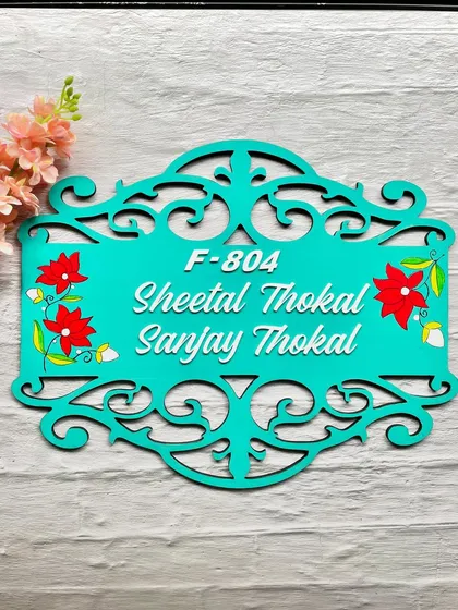 Here is the full view of the floral wooden nameplate, ready to bring a touch of handcrafted beauty to a new home.