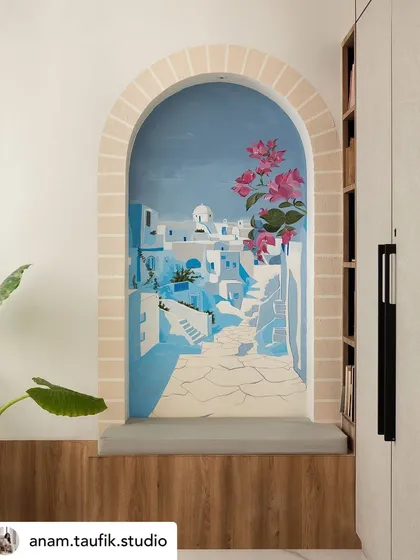 A small nook in a master bedroom becomes a window to Santorini. This scenic mural is designed to transport you, creating a personal seaside retreat and a serene escape within your own home.