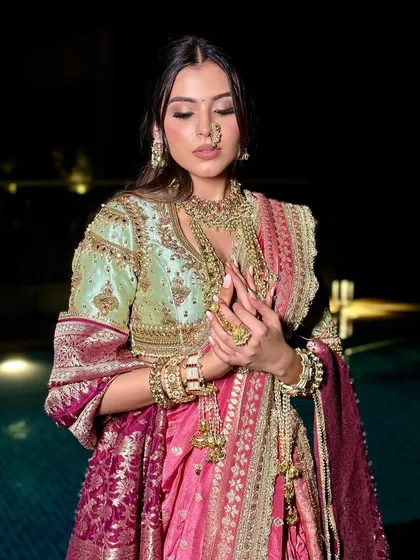 This image showcases the intricate details of the jewelry and the soft, glowing makeup that ties the entire look together.