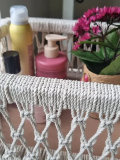 Here is one of my multipurpose macrame baskets in action, neatly organizing skincare products and adding a touch of elegance to the countertop. This shows how my creations are not just decorative but also highly functional, perfect for gift hampers or home organization.