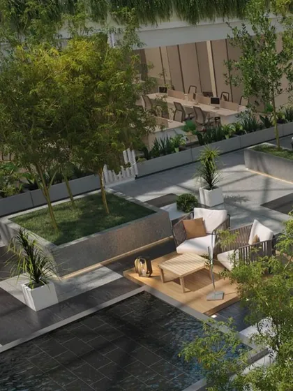 At the heart of the Hamdard HQ in New Delhi, we designed a biophilic central courtyard. This light-filled atrium, featuring trees and informal seating, serves as a green lung for the office, promoting employee wellbeing and providing a serene space for pause and collaboration.