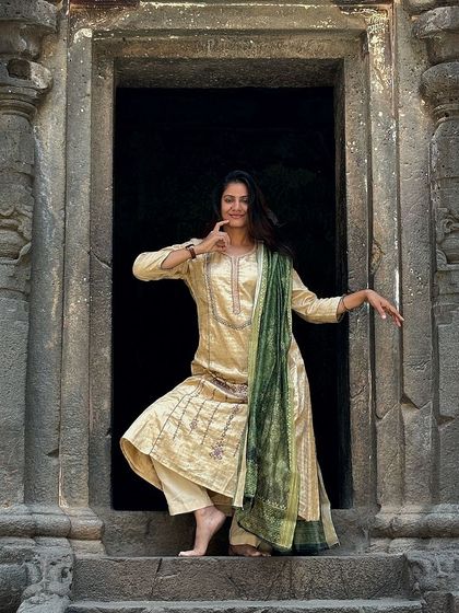 A close-up of my pose at the Kailasa temple in Ellora. The intricate carvings and spiritual atmosphere of this place fill me with creative energy.