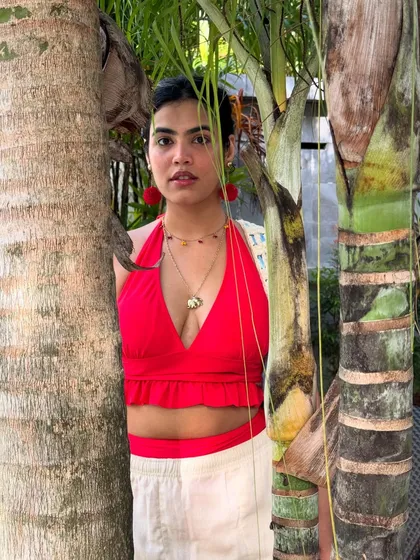 Peeking through the trees. This red halter top is such a powerful color.