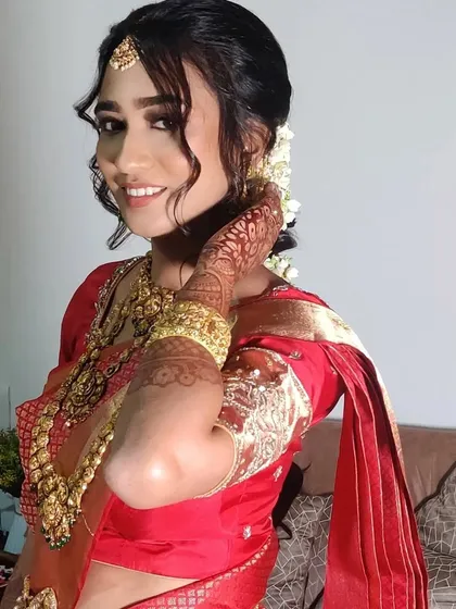 A happy, candid shot of Ankita, showcasing her radiant smile and beautiful bridal glow.