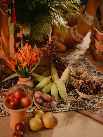 A detail shot of the rustic, market-style decor for the Turkish Haldi, featuring fresh produce like corn, apples, and spices, adding an authentic touch to the theme.